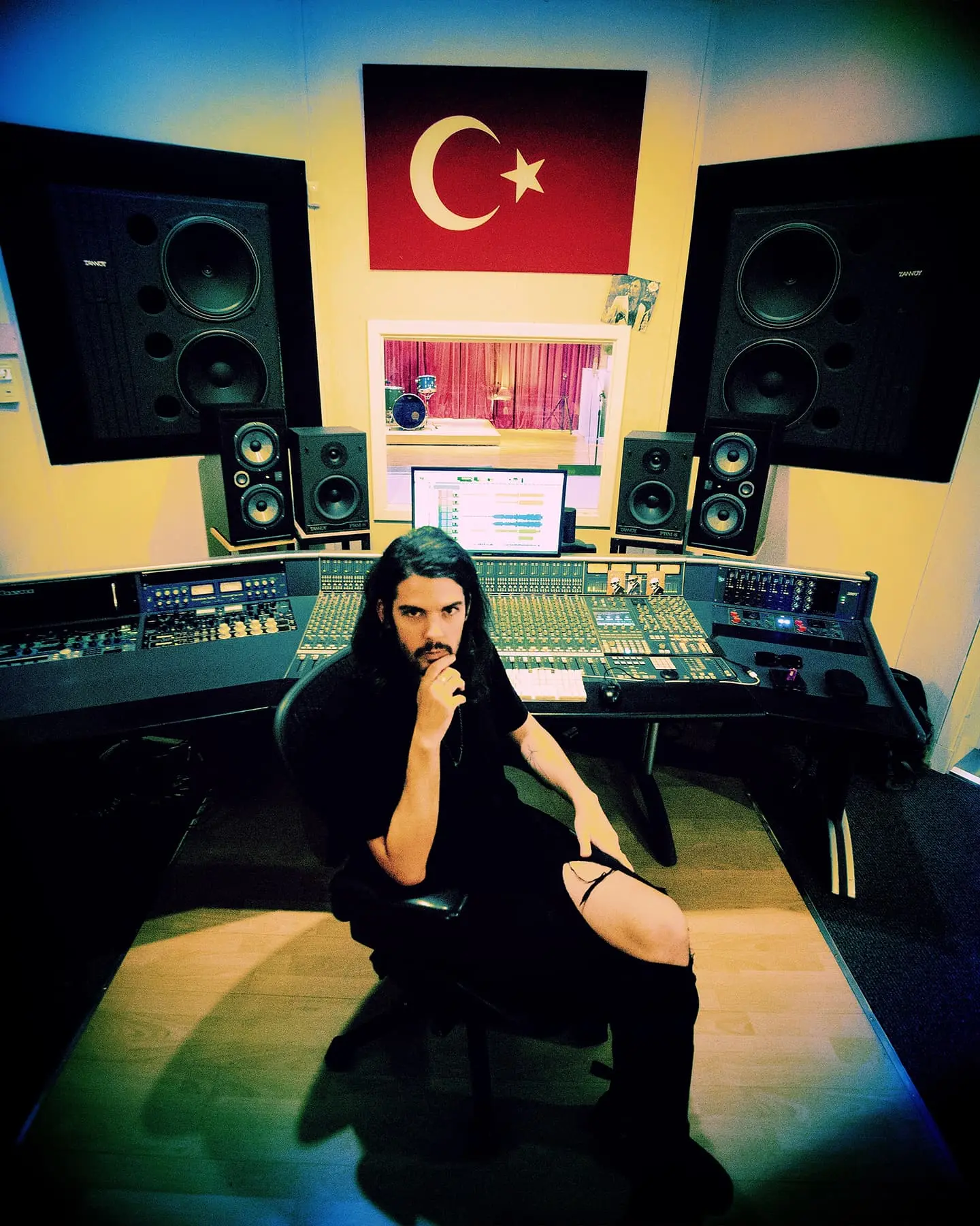 Estanislao López at Unisomo music studios working in the mixing board